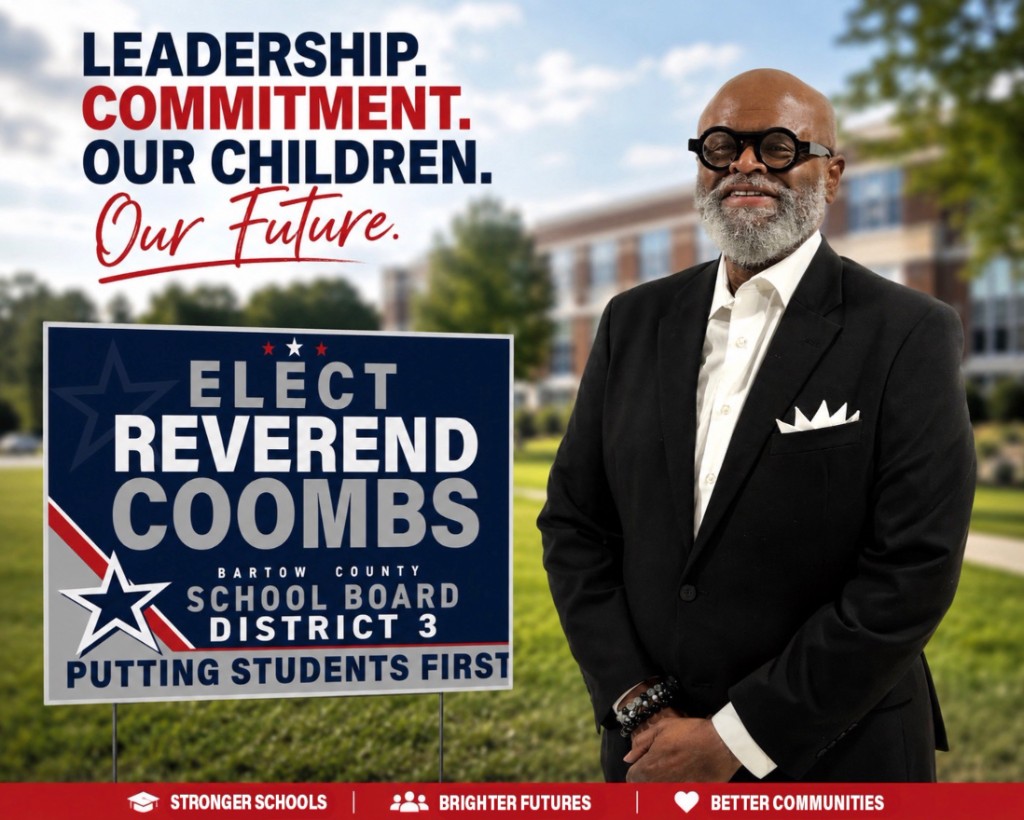 Reverend Willie Coombs smiling in front of a Bartow County school